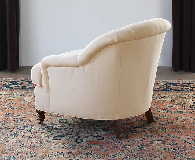 Tufted Back Club Chair in Linato Cream with Black Walnut Turned Legs