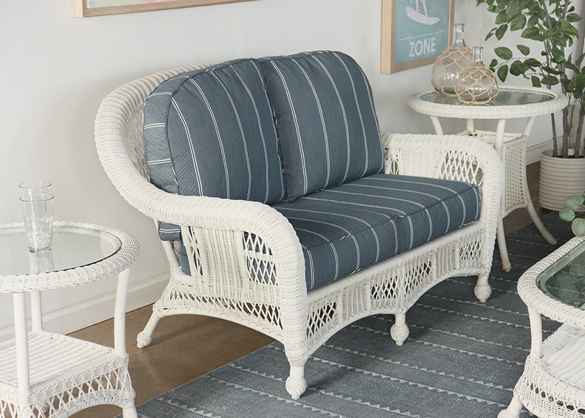 White Wicker Loveseat with Blue and White Cushion