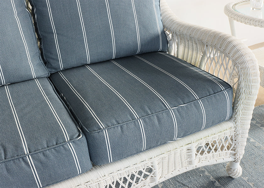 White Wicker Loveseat with Blue and White Cushion
