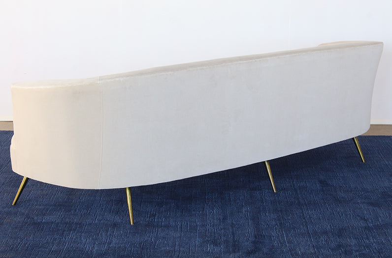 SF239 - Curved Sofa With Tight Back And Antique Brass Legs