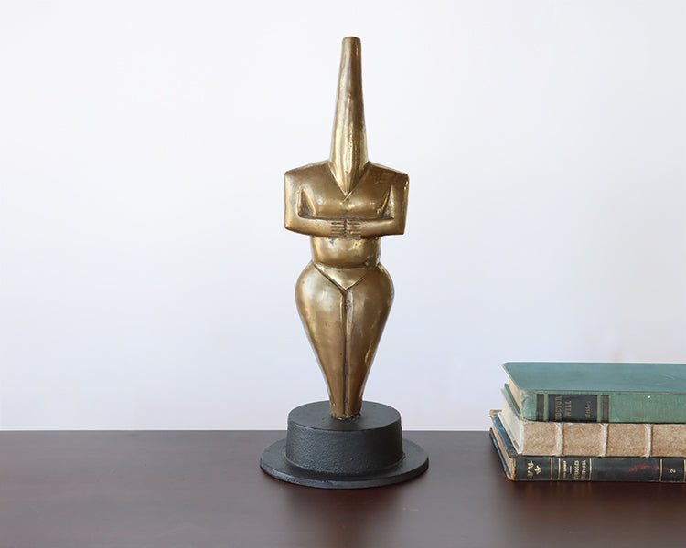 Gold Figure on Black Metal Base