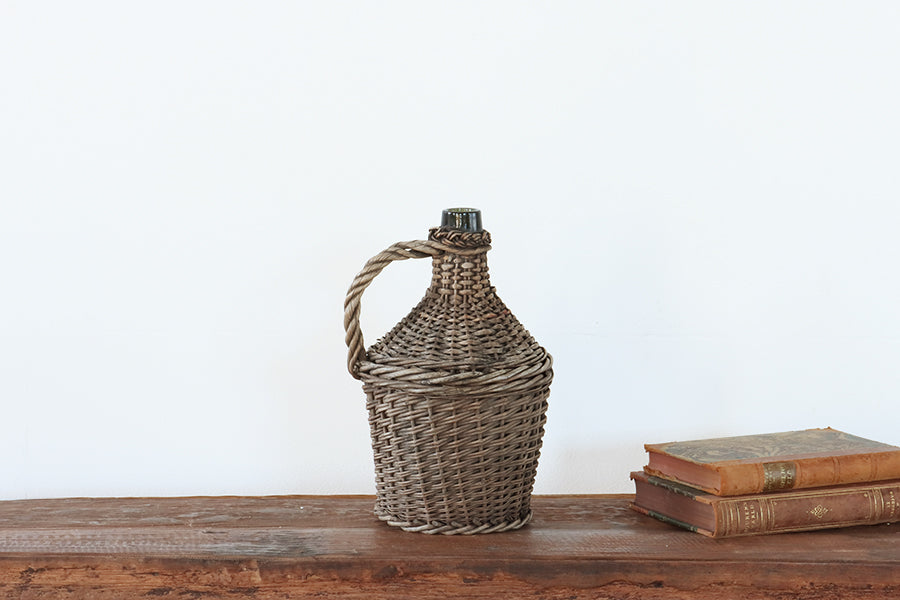 Small Wicker Covered Wine Bottle