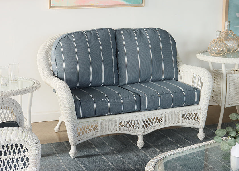 White Wicker Loveseat with Blue and White Cushion