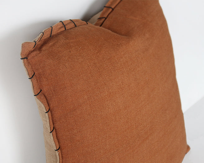 Rust Pillow With Black Stitched Edge