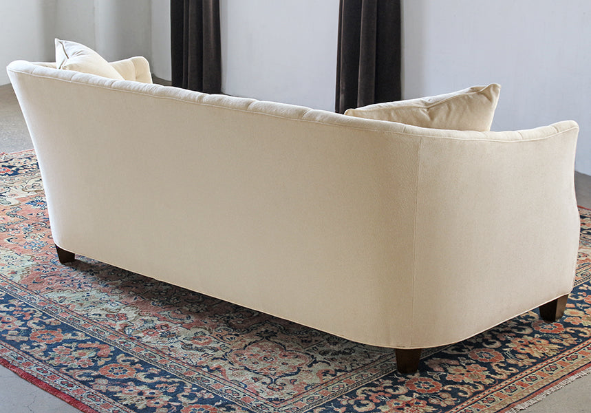 Curved Sofa with Tufted Back in Linato Cream